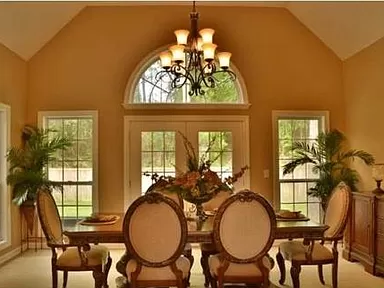 Picture of the sunroom used as a dining room in the house for sale by owner in the Coosaw Creek Country Club neighborhood.
