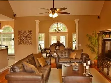 Picture of the main living room and sunroom located in the homeowners home for sale in North Charleston, South Carolina in Coosaw Creek Country Club.