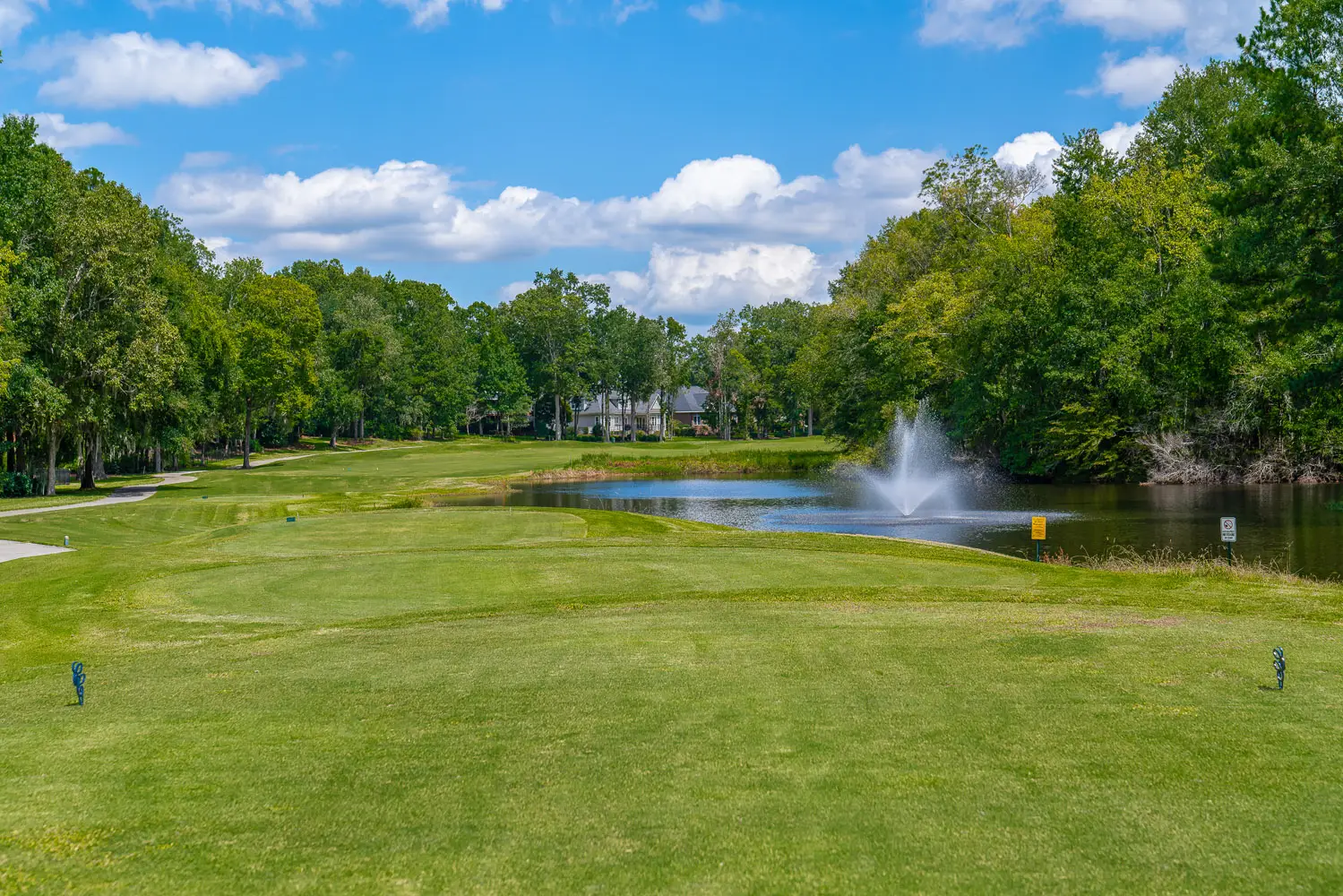 Picture of the golf green with a water fountain near house for sale by owner in the Coosaw Creek Country Club located in North Charleston, SC  29420.